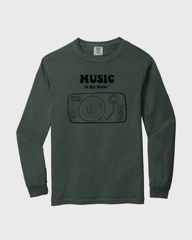 Green long-sleeve shirt with 'Music is my detox' graphic and text