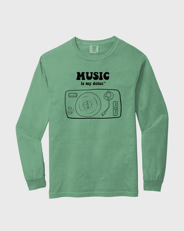 Green long-sleeve shirt with 'Music is my detox' graphic and text 