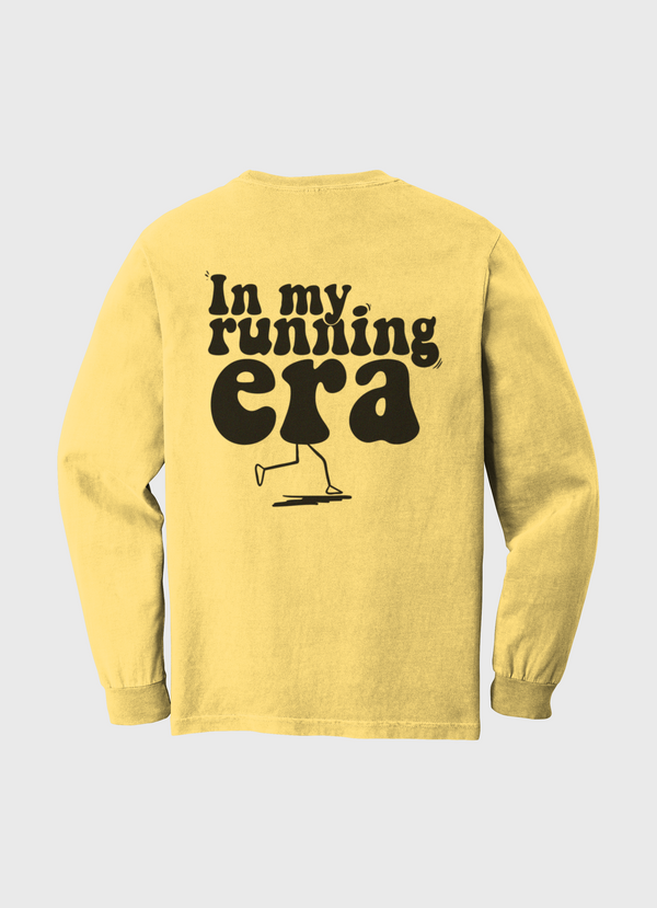 Yellow long-sleeve shirt with 'In my running era' text and graphic 