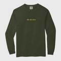 Green long-sleeve shirt with yellow text FIND YOUR DETOX
