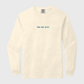 Beige long-sleeve shirt with blue text FIND YOUR DETOX