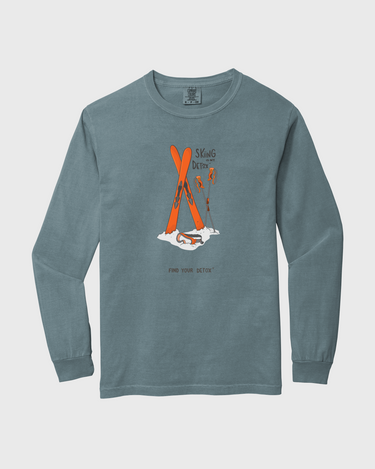 Blue long-sleeve shirt with orange graphic on a light gray background
