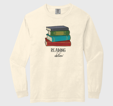 Long-sleeve shirt with a graphic of books and text on a white background