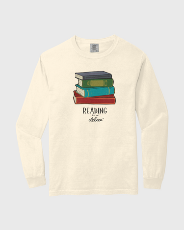 Long-sleeve shirt with a graphic of books and text on a white background