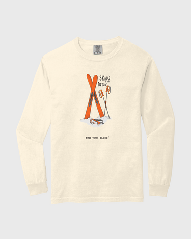 Beige long-sleeve shirt with graphic design on a light gray background