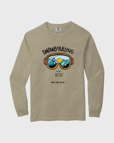 Beige long-sleeve shirt with snowboarding graphic and text on a white background