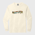 Beige long-sleeve shirt with 'NATURE' text on a light gray background