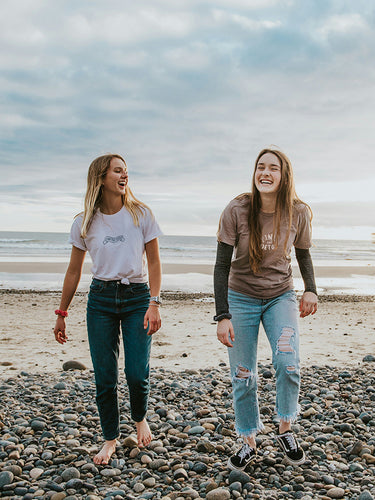 Friends Walking On Beach
